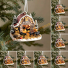 Decorative Christmas ornament of a barn with animals on a tree branch.