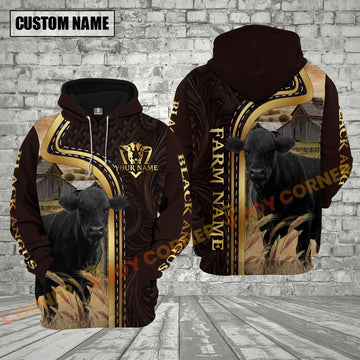 Hoodie with black cow design and customizable text on a brick wall background