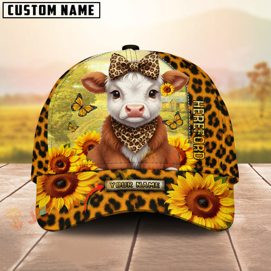 Cap with cow design, sunflowers, and leopard print on a wooden surface with blurred background