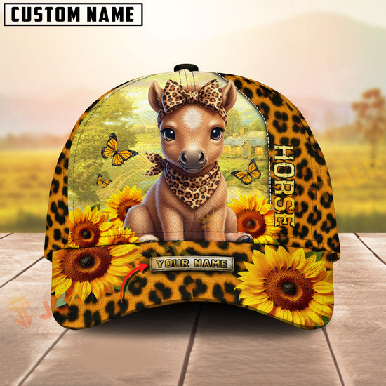 Cap with horse design, sunflowers, and leopard print on a wooden surface with a blurred natural background.