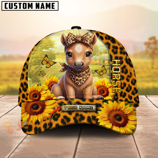 Cap with horse design, sunflowers, and leopard print on a wooden surface with a blurred natural background.