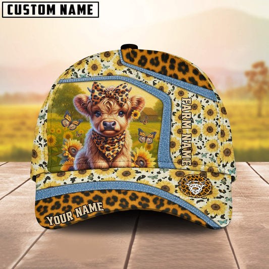 Cap with a design of a baby lion, sunflowers, and butterflies on a wooden surface with a blurred natural background.