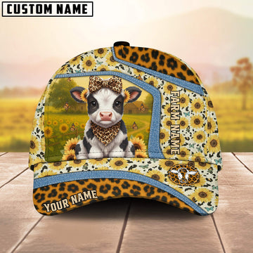 Cap with cow design and sunflower pattern on a wooden surface with blurred background