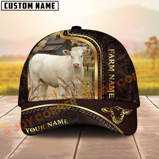 Cap with cow design and 'Farm Name' text on a wooden surface with blurred field background