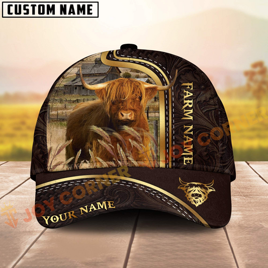 Cap with a highland cow design on a wooden surface with a blurred farm background