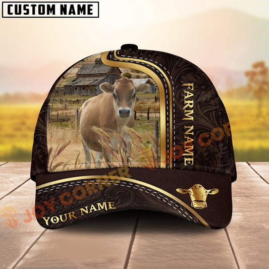 Cap with cow design and 'Farm Name' text on a wooden surface with blurred background