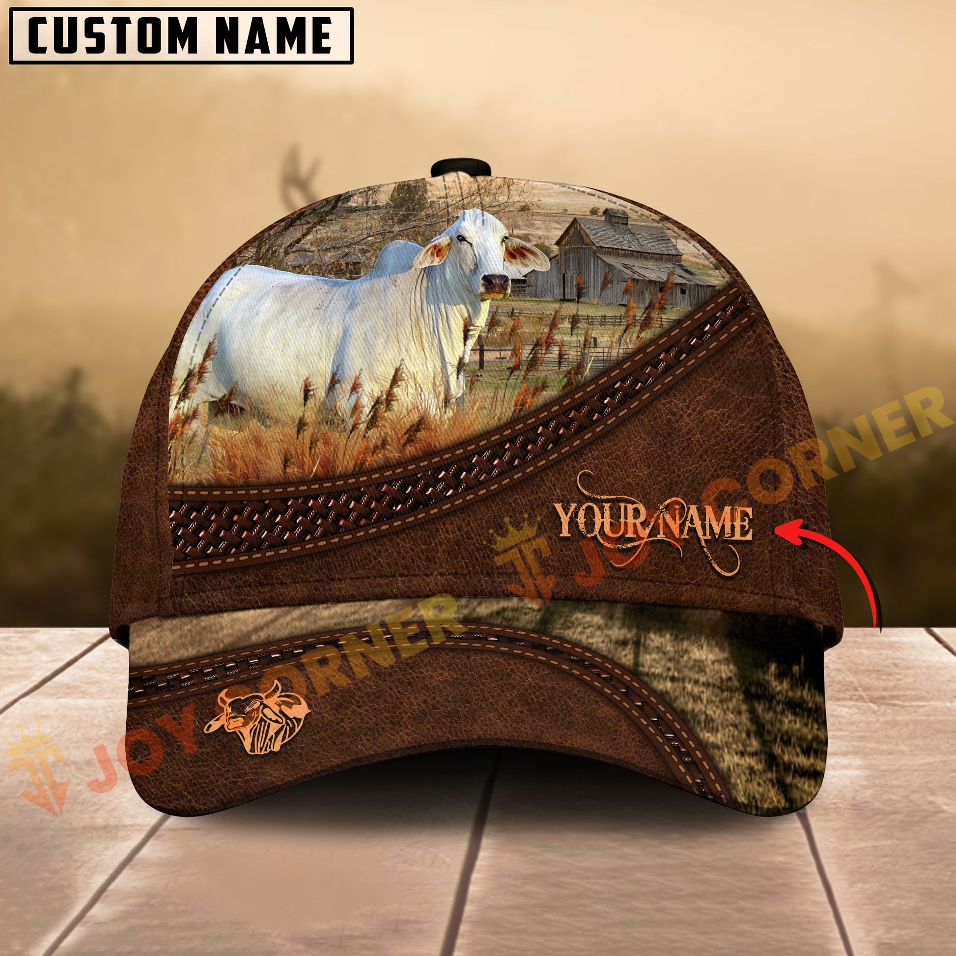 Customizable cap with cow design and 'Your Name' text on a wooden surface.