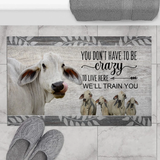 Joycorners Brahman Cattle "You Don't Have To Be Crazy To Live Here We Will Train You" Doormat
